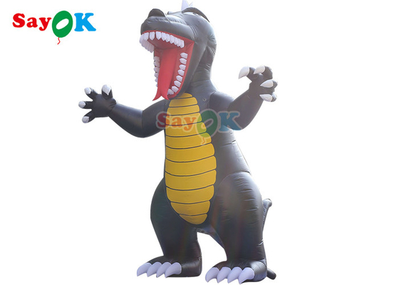 I personaggi dei cartoni animati gonfiabili di pubblicità all'aperto fanno scoppiare il pallone animale del dinosauro